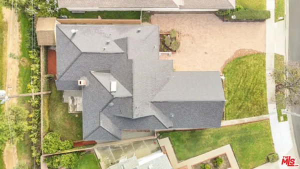 aerial view of a house with a yard