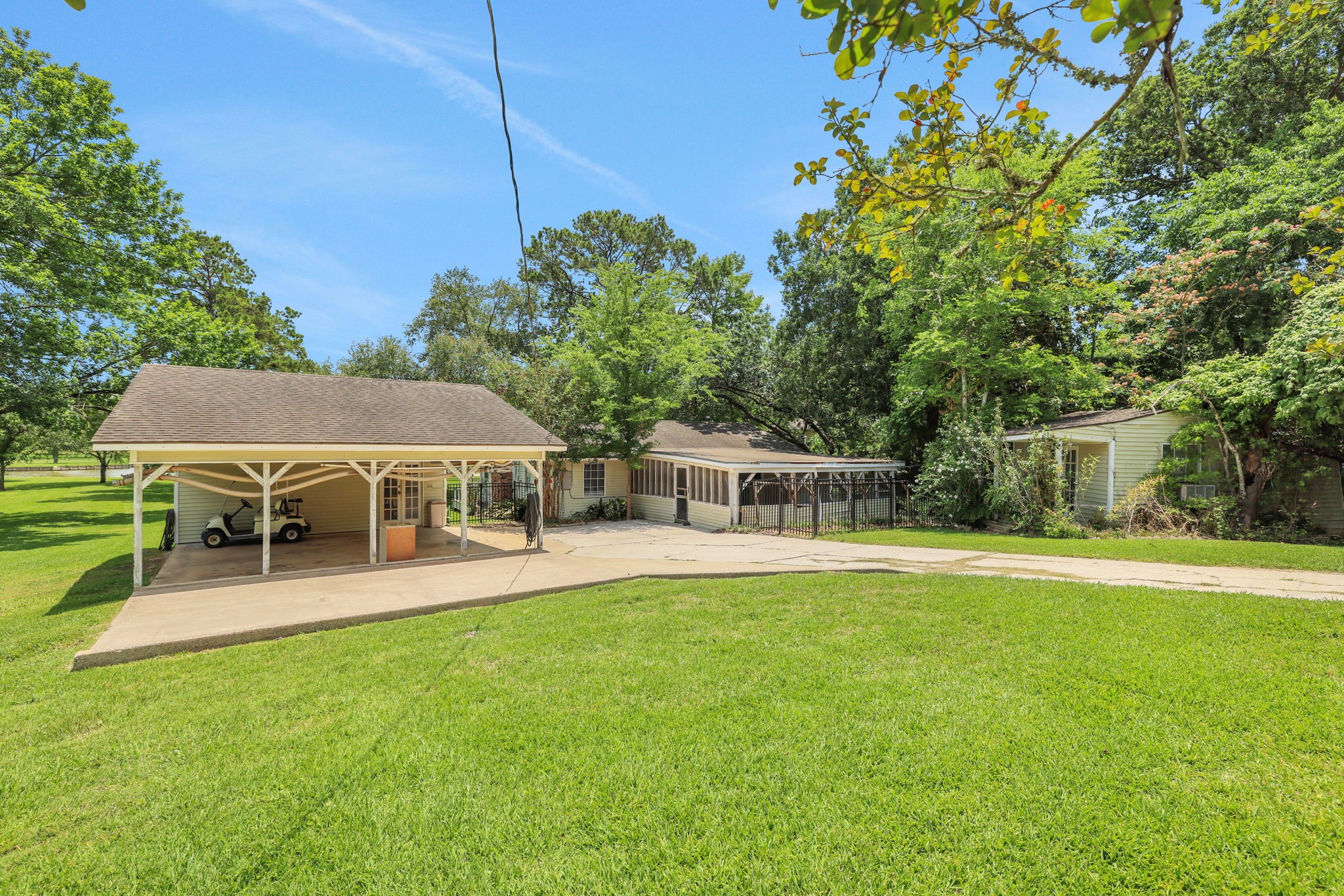 151 Lakeview Circle Coldspring, TX 77331 - Photo 13 of 29 The home has a carport and workshop