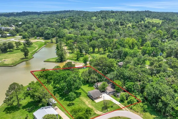 a view of a lake with a yard