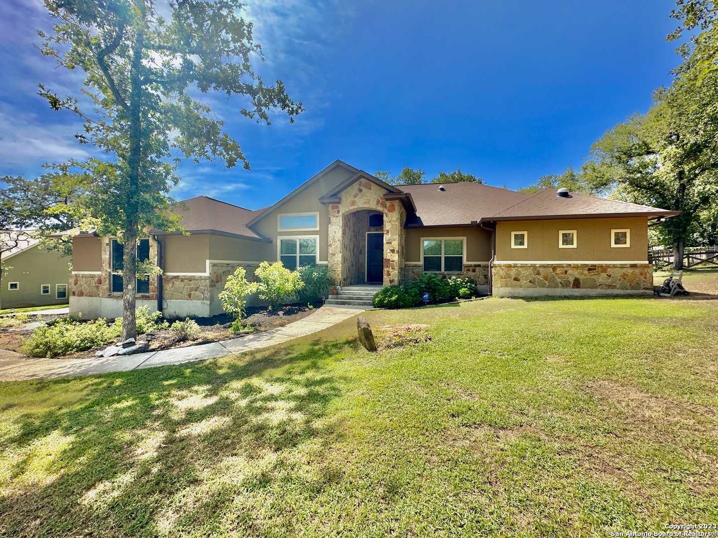 a front view of a house with garden