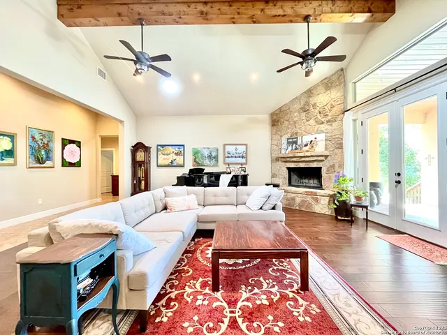 a living room with furniture or fireplace and a wooden floor