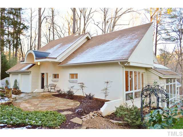 2405 Countrywood Road Raleigh, NC 27615 - Photo 1 of 25 This spectacular contemporary/transitional home is graced with a circular drive and gorgeous landspacing including lots of flagstone patios, walkways, and beautiful plants. Just beautiful views from every angle! Facade/Exterior Front