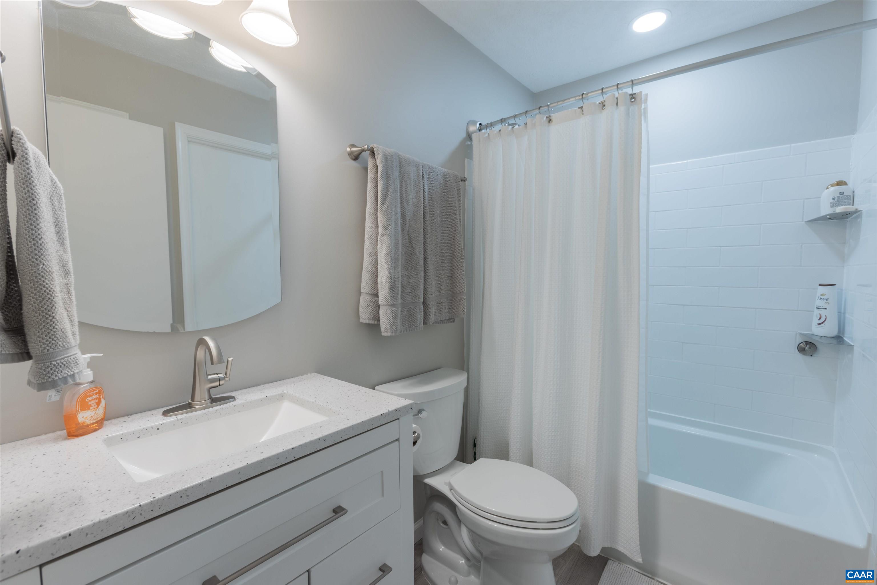 2550 Proffit Road Charlottesville, VA 22911 - Photo 12 of 41 a bathroom with a sink a toilet and shower