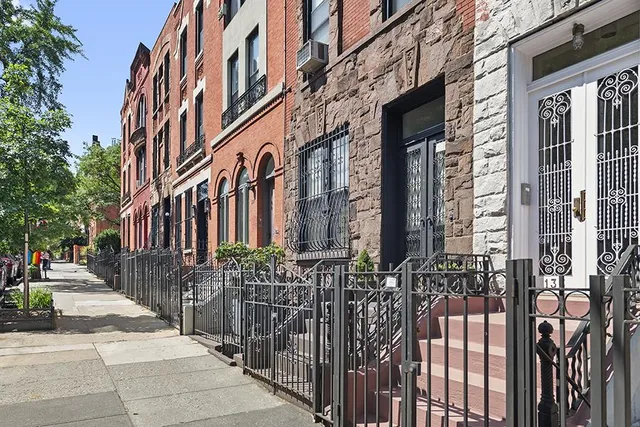 a black and white photo of a bedroom