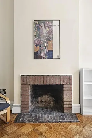 a view of an entryway with a fireplace and a window