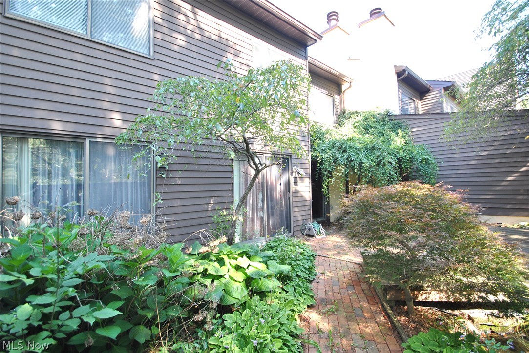 517 Hampton Ridge Drive Akron, OH 44313 - Photo 1 of 19 Perennial gardens and brick walkway enhance the private patio at this beautiful 3 bedroom condo in Hampton Woods.