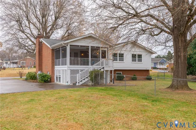 a front view of house with yard and trees