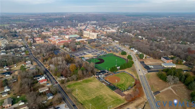 an aerial view of residential houses with outdoor space