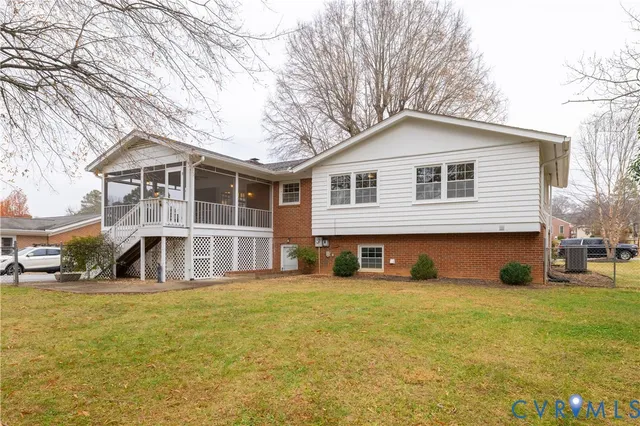a front view of a house with a yard outdoor seating and garage