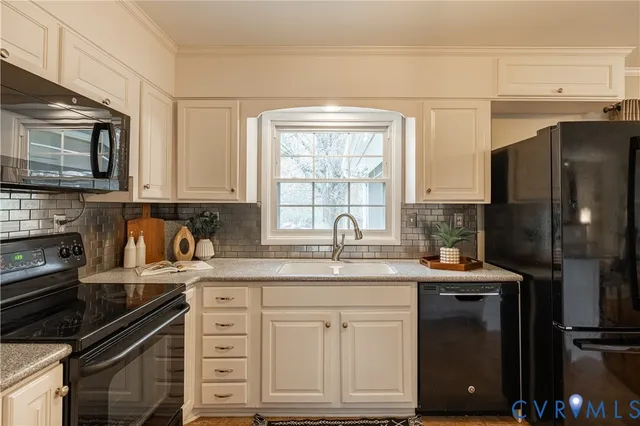 a kitchen with a sink stove and refrigerator