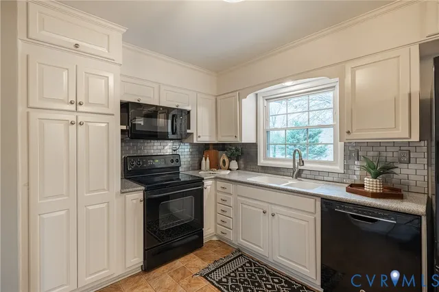 a kitchen with a sink stove and microwave