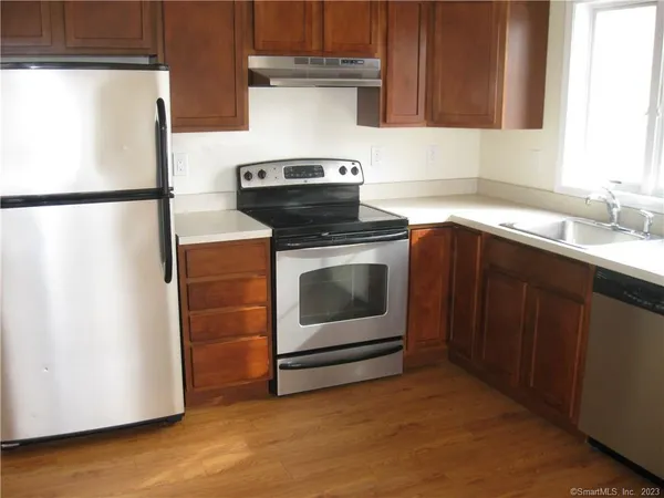 a kitchen with a stove and a microwave