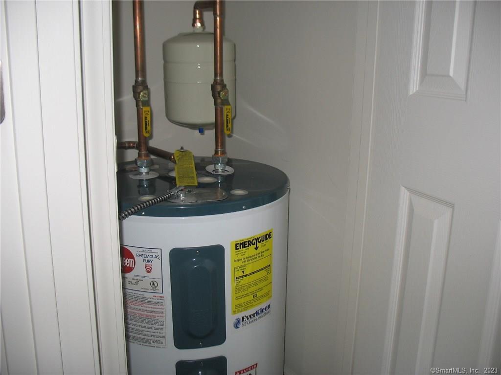 7 New Street, Unit 305 Danbury, CT 06810 - Photo 11 of 15 a bathroom with a sink and mirror