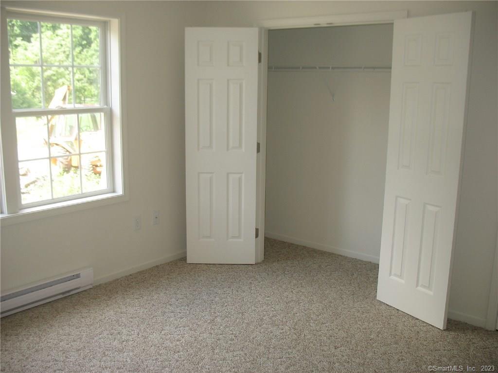 7 New Street, Unit 305 Danbury, CT 06810 - Photo 6 of 15 an empty room with windows