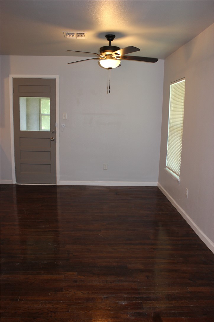 116 Allen Drive Portland, TX 78374 - Photo 2 of 6 a view of a room with wooden floor and fan