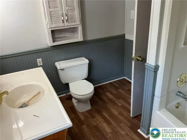 a bathroom with a toilet and a sink