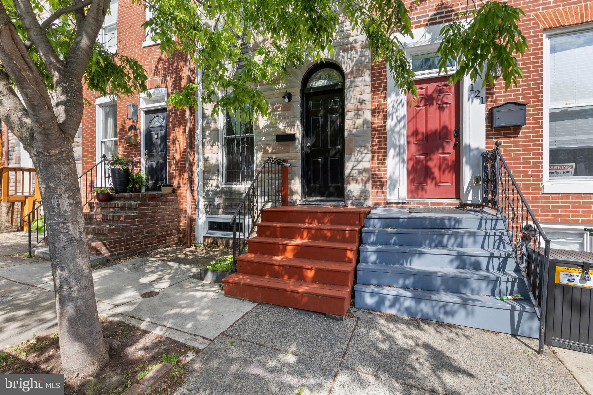 119 South Poppleton Street Baltimore, MD 21201 - Photo 1 of 27 a front view of a house with a yard