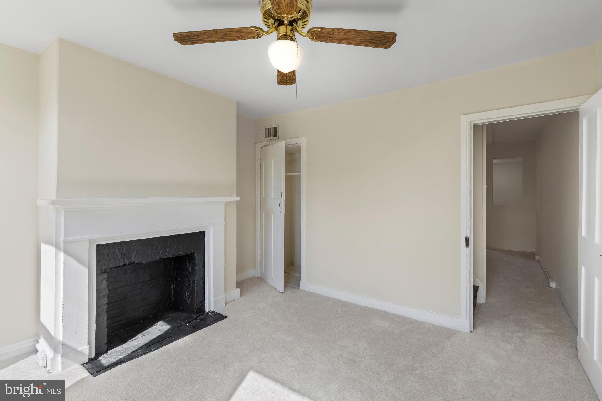 119 South Poppleton Street Baltimore, MD 21201 - Photo 16 of 27 a living room with furniture and a fireplace