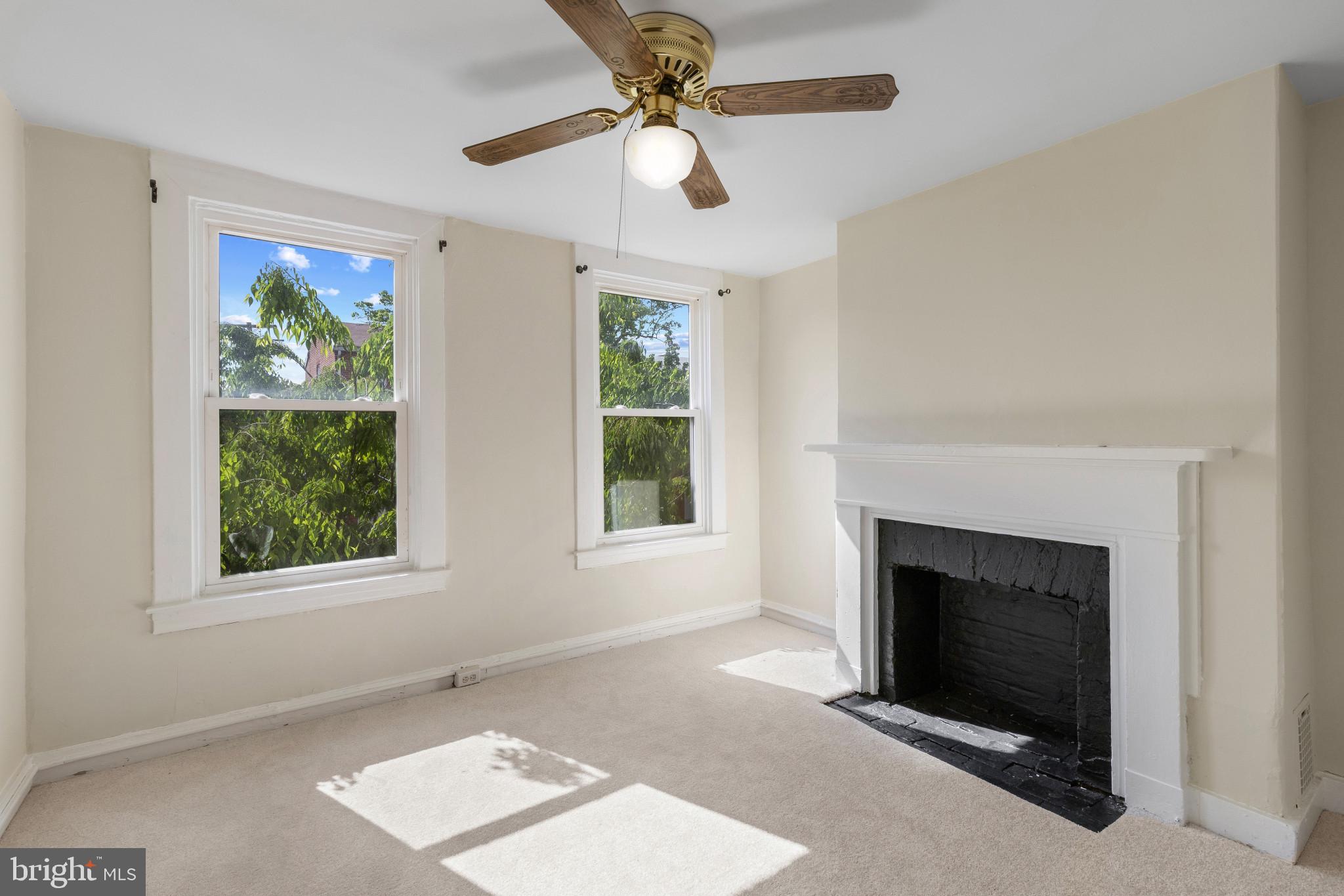 119 South Poppleton Street Baltimore, MD 21201 - Photo 17 of 27 a living room with furniture and a fireplace