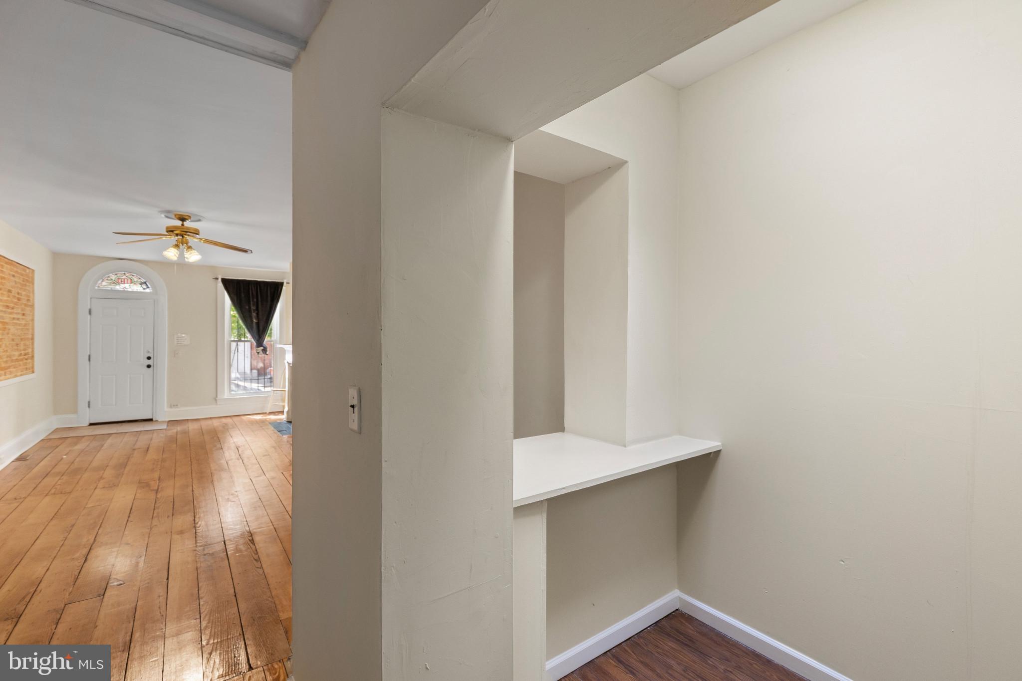 119 South Poppleton Street Baltimore, MD 21201 - Photo 7 of 27 a view of empty room with wooden floor and fan