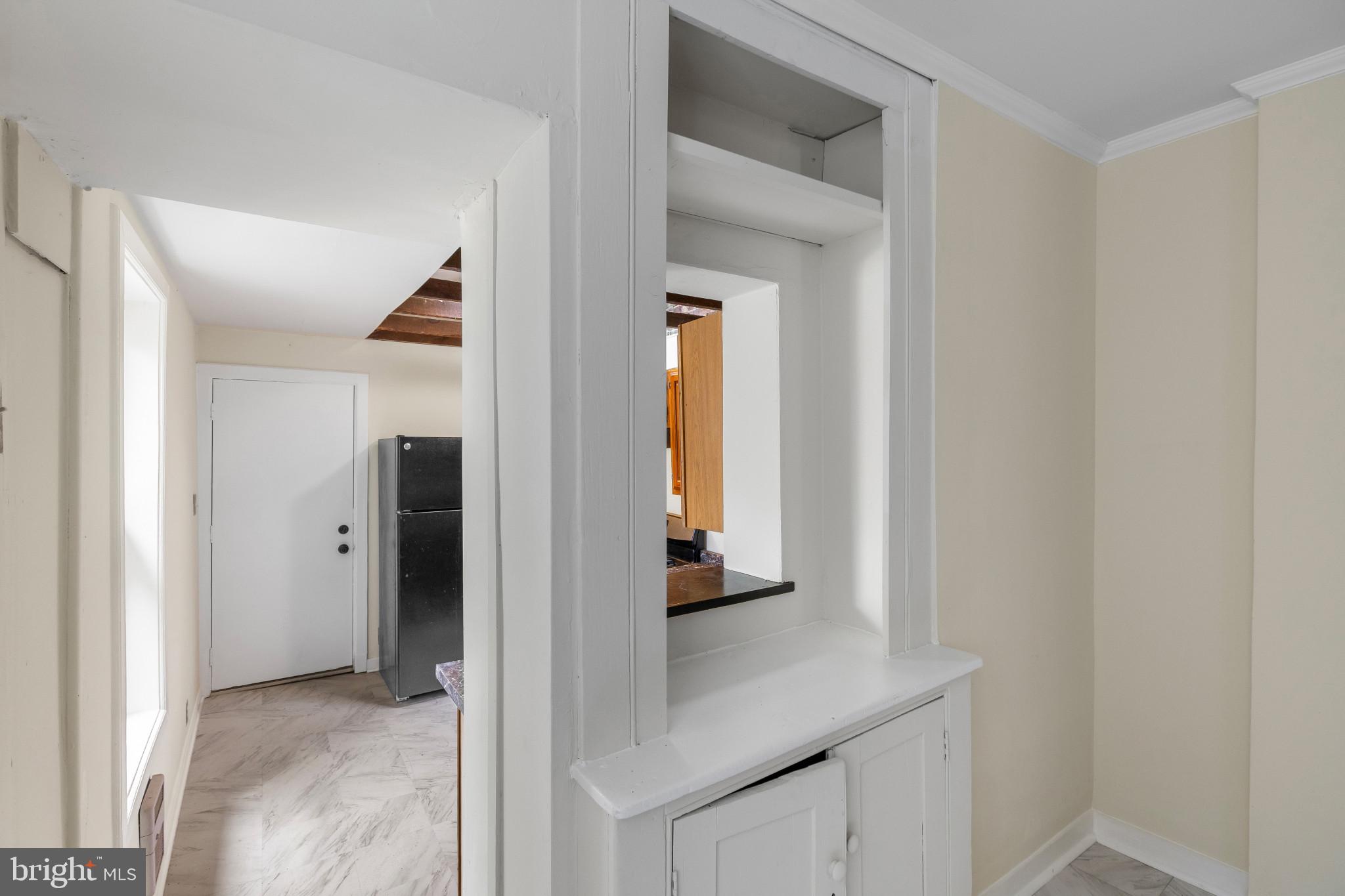 119 South Poppleton Street Baltimore, MD 21201 - Photo 10 of 27 a view of a hallway with wooden cabinets