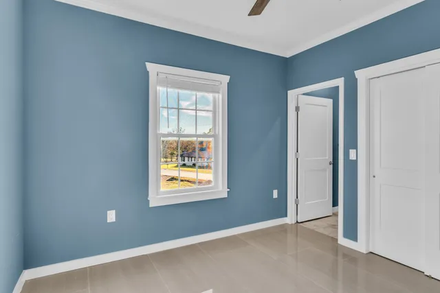 a view of a house with backyard and a fence