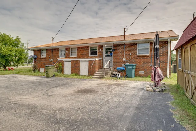 a view of an empty room and wooden floor