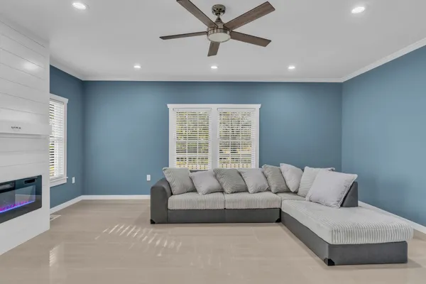 a living room with furniture and a fireplace