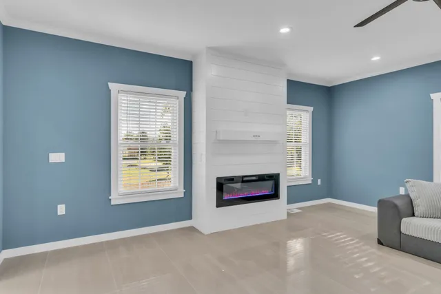 a kitchen with stainless steel appliances granite countertop a white cabinets and a refrigerator