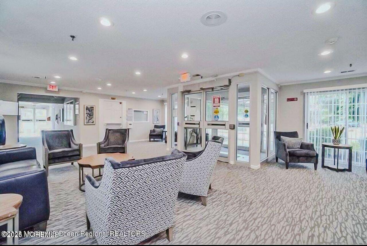 3 Gatley Close, Unit 1000 Freehold, NJ 07728 - Photo 13 of 24 a living room with lots of furniture and a table