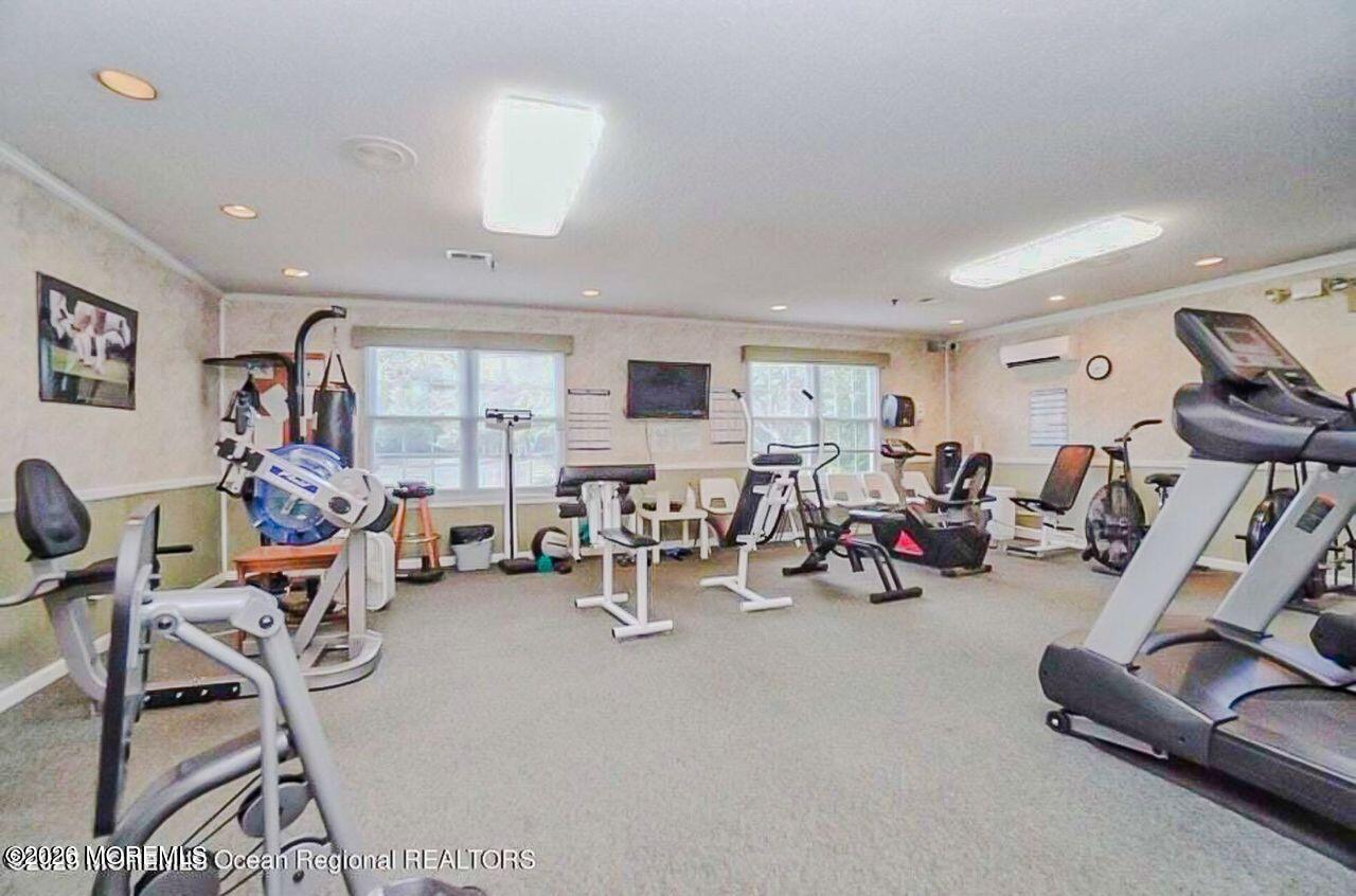 3 Gatley Close, Unit 1000 Freehold, NJ 07728 - Photo 14 of 24 a view of a room with gym equipment