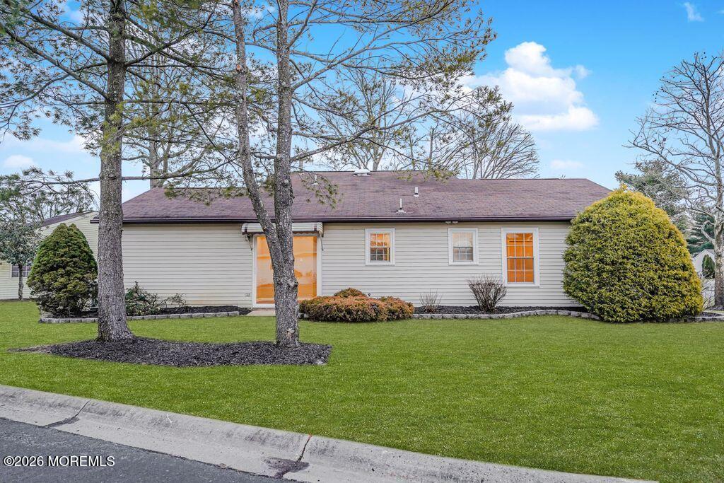 3 Gatley Close, Unit 1000 Freehold, NJ 07728 - Photo 20 of 24 a front view of a house with a yard and garage