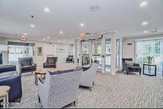 a living room with lots of furniture and a table