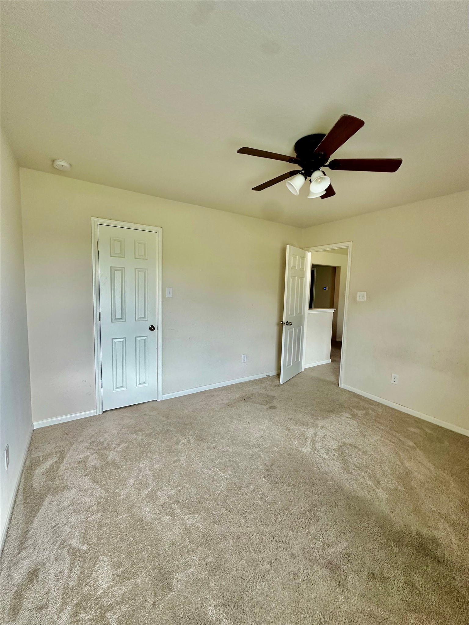 18622 Each Elm Way Houston, TX 77084 - Photo 32 of 35 an empty room with chandelier fan and windows