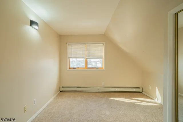 an empty room with a empty space and a window