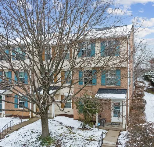 a view of a building with a yard