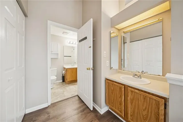 a bathroom with a sink a mirror and a shower