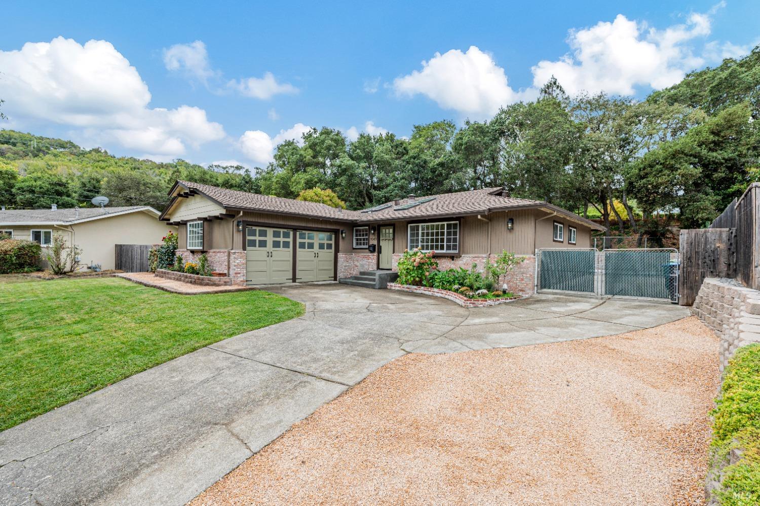 a view of house with yard and entertaining space