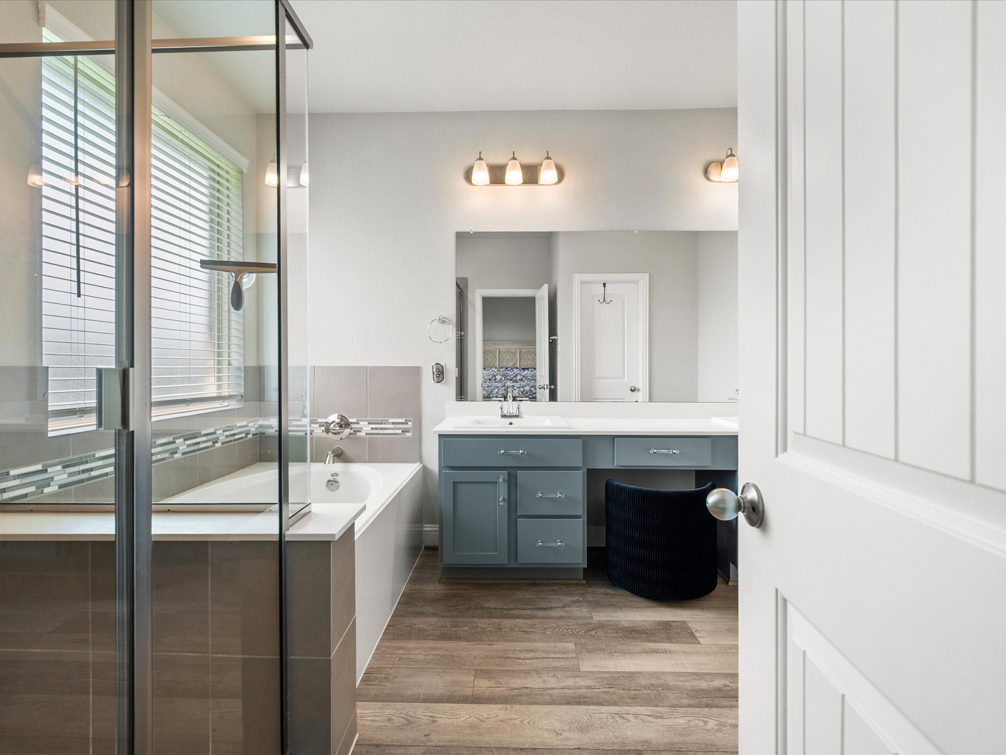 7123 Poppyseed Trail Spring, TX 77379 - Photo 14 of 30 Relax and recharge in the ensuite featuring a soaking tub, separate shower, and a layout designed for everyday comfort.