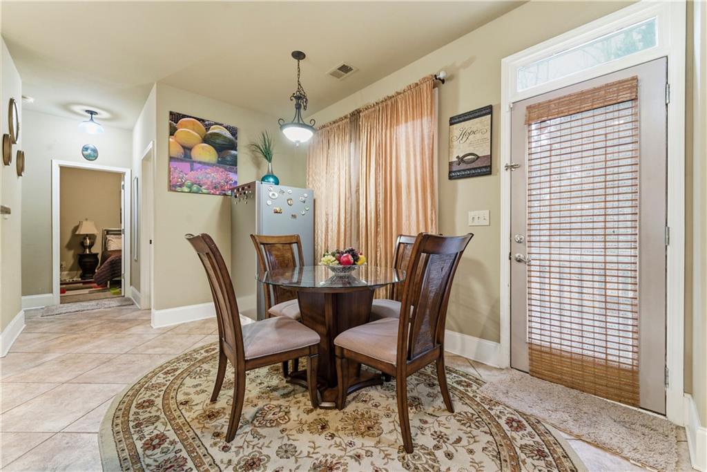 3411 Lynne Road Powder Springs, GA 30127 - Photo 11 of 27 a dining room with furniture and window