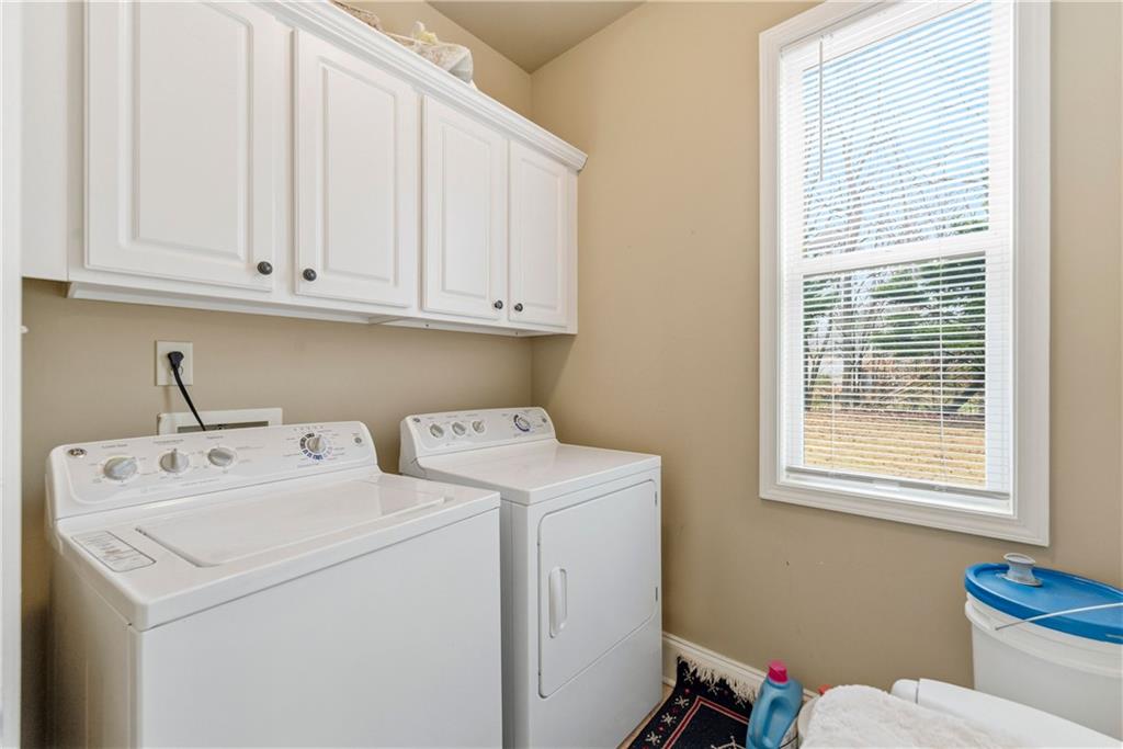 3411 Lynne Road Powder Springs, GA 30127 - Photo 16 of 27 a utility room with dryer and washer