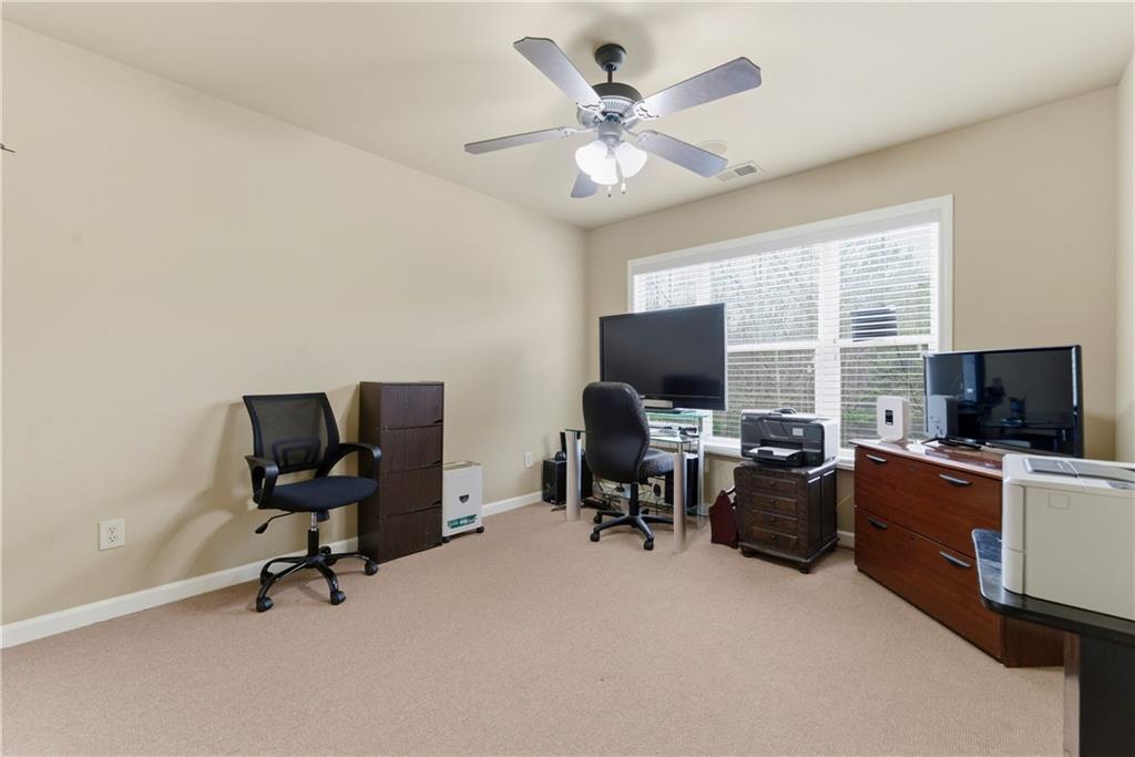 3411 Lynne Road Powder Springs, GA 30127 - Photo 19 of 27 a view of a livingroom with workspace and a window