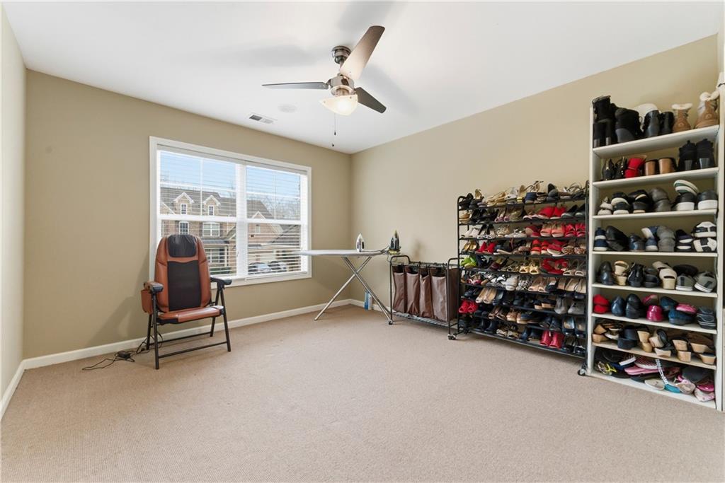 3411 Lynne Road Powder Springs, GA 30127 - Photo 20 of 27 a living room with lots of furniture and a window