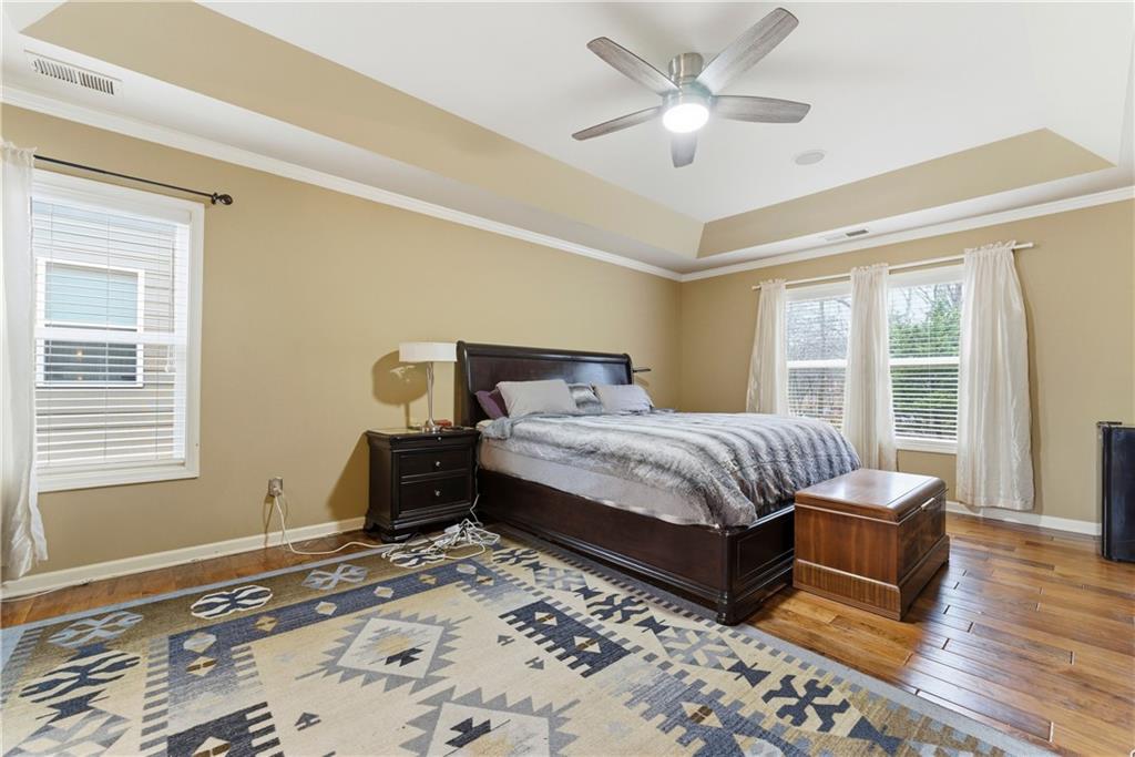 3411 Lynne Road Powder Springs, GA 30127 - Photo 23 of 27 a bedroom with a bed and wooden floor