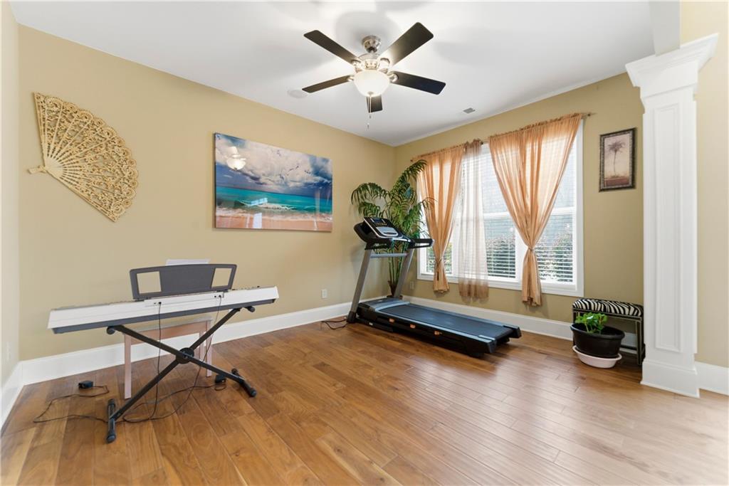 3411 Lynne Road Powder Springs, GA 30127 - Photo 4 of 27 a room with gym equipment and a large window