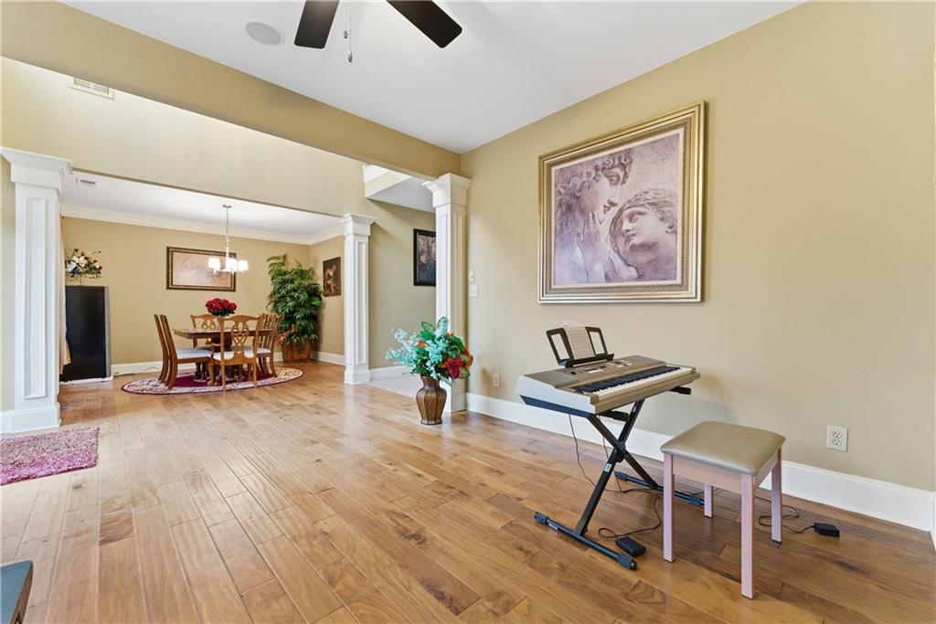 3411 Lynne Road Powder Springs, GA 30127 - Photo 5 of 27 a view of a livingroom with furniture and a ceiling fan