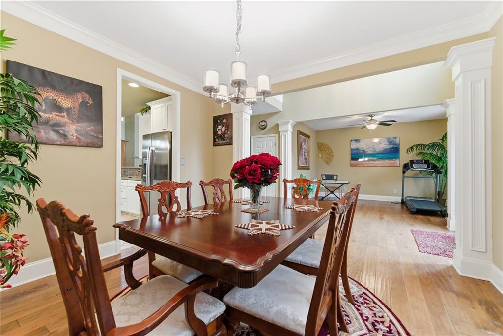 3411 Lynne Road Powder Springs, GA 30127 - Photo 6 of 27 a view of a dining room with furniture and chandelier