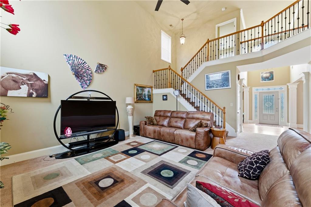 3411 Lynne Road Powder Springs, GA 30127 - Photo 8 of 27 a living room with furniture a rug and a window