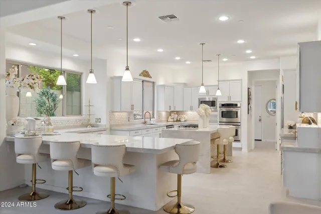 a kitchen with stove and refrigerator
