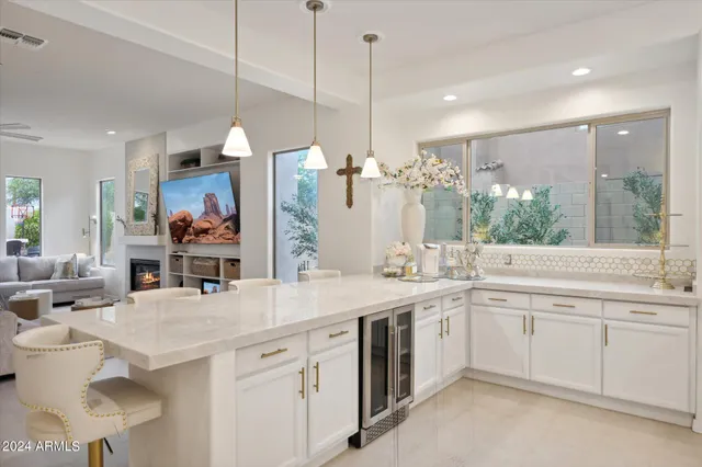 a kitchen with a sink a stove and refrigerator